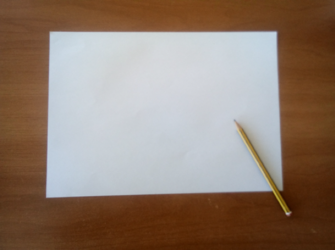 Una hoja de papel blanco y un lápiz negro. 