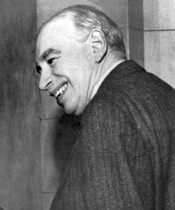Keynes de espaldas, sonriendo y mirando hacia la izquierda.