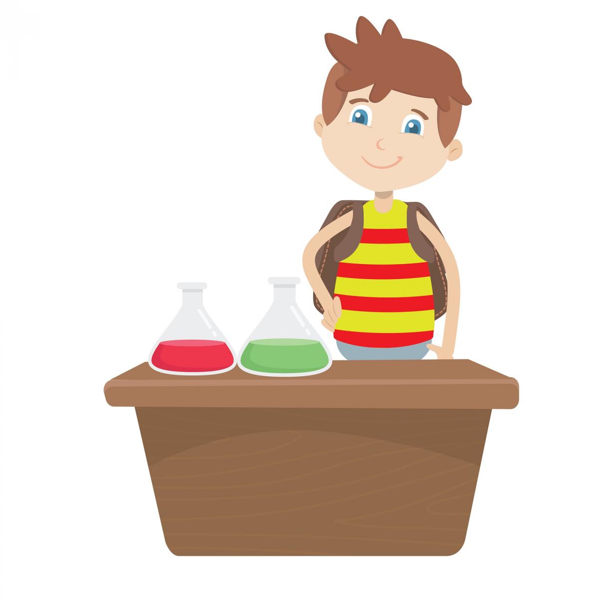 Niño parado frente a mesa de laboratorio