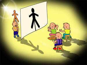Un niño proyecta la sombra de una figura delante de un grupo de compañeros.
